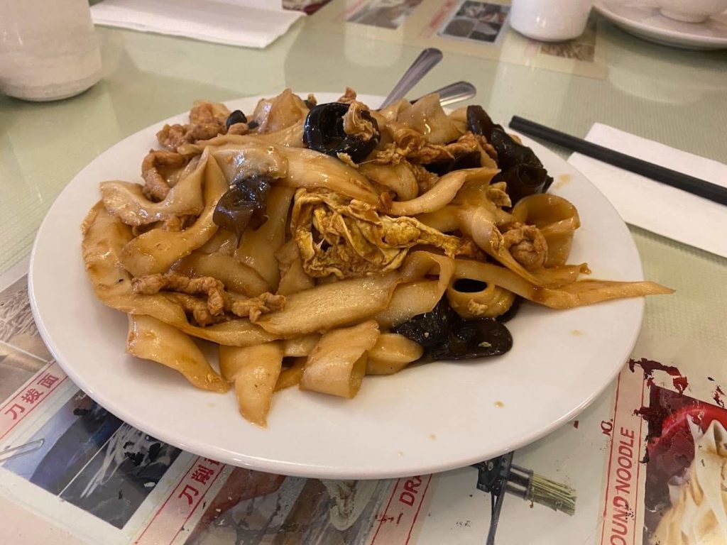 Noodle dish with pork and pickled cabbage