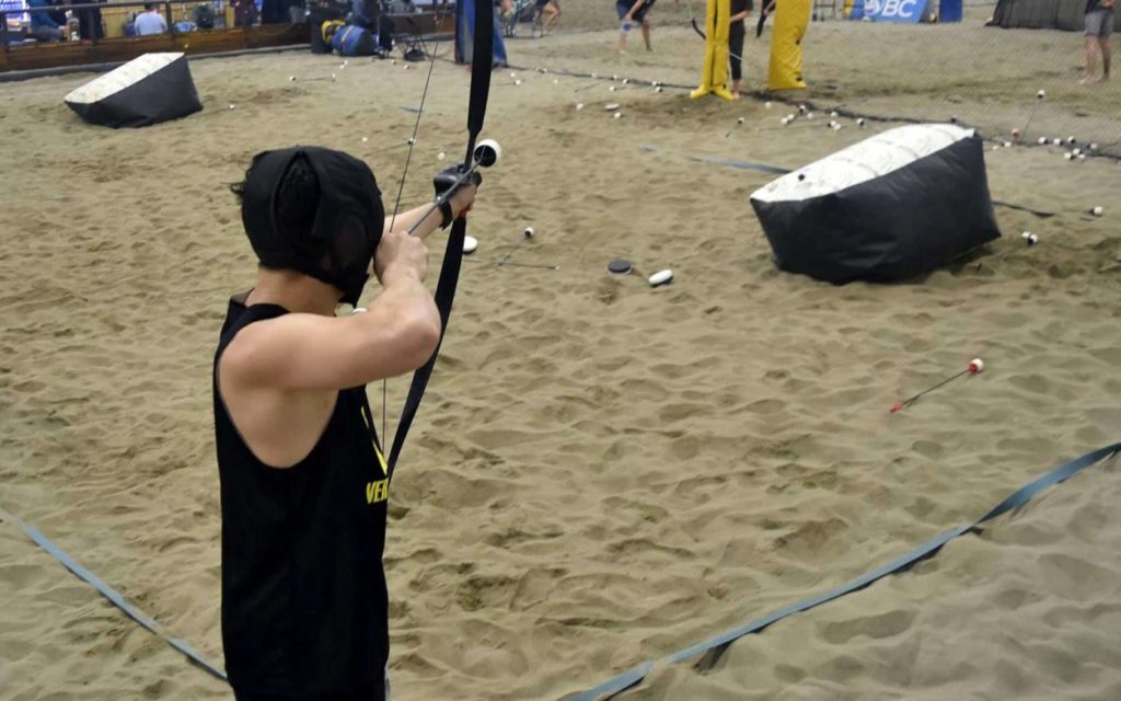 Shoot Arrows at an Indoor Beach Arena